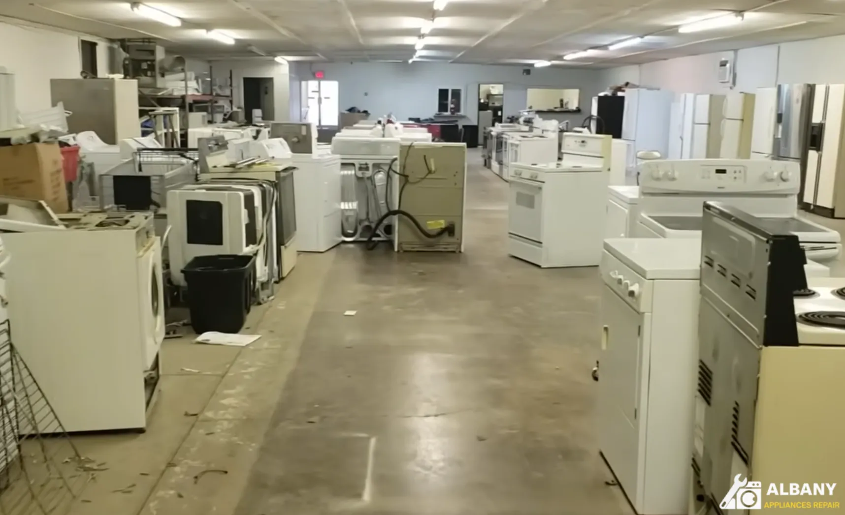 Row of white appliances in showroom
