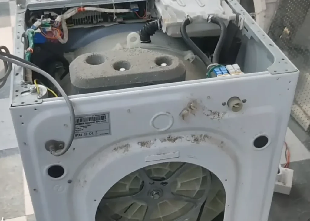 opening the screws of washing machine