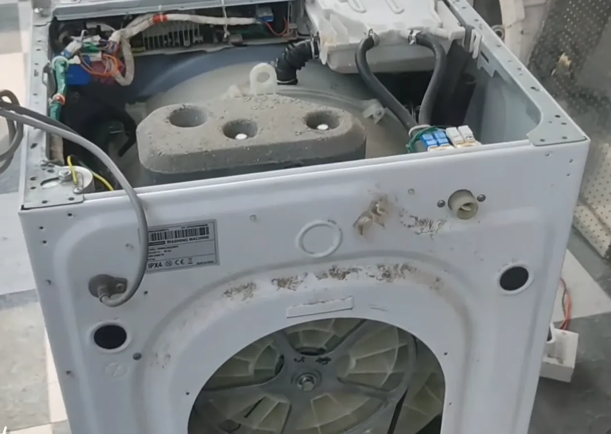 opening the screws of washing machine